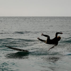 Surfer Falls off his wave